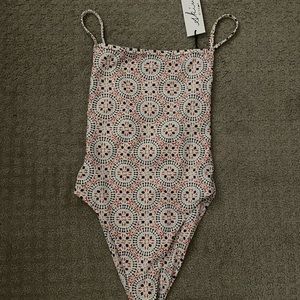 Brand new never worn. Amazing swimming suit.